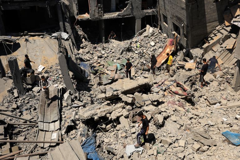 Palestinians inspect the site of an Israeli strike on a house that was pre-warned by the Israeli military to evacuate, before the strike was carried out late on Thursday at Shati (Beach) refugee camp, in Gaza City, May 29, 2026. REUTERS/Dawoud Abu Alkas
