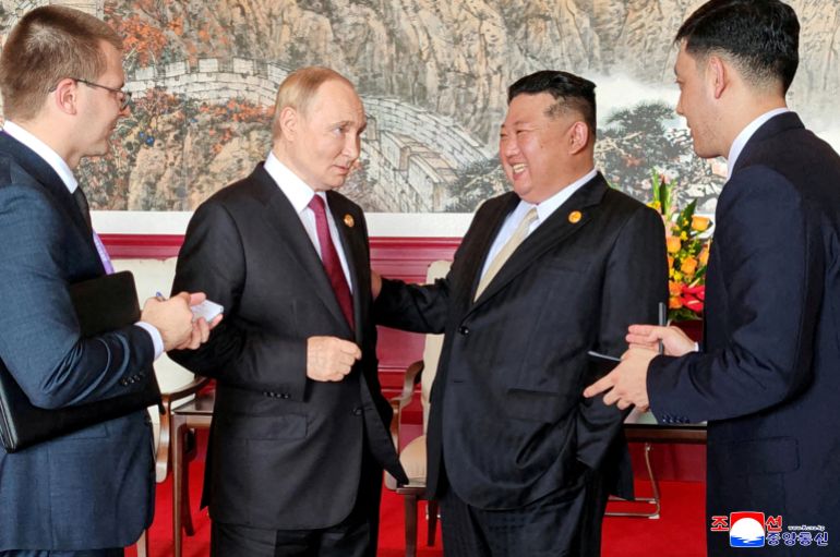 FILE PHOTO: North Korean leader Kim Jong Un speaks with Russian President Vladimir Putin during their visit to Beijing to attend China's commemoration of the 80th anniversary of the end of World War Two, in Beijing, China, September 3, 2025, in this picture released by the Korean Central News Agency. KCNA via REUTERS ATTENTION EDITORS - THIS IMAGE WAS PROVIDED BY A THIRD PARTY. REUTERS IS UNABLE TO INDEPENDENTLY VERIFY THIS IMAGE. NO THIRD PARTY SALES. SOUTH KOREA OUT. NO COMMERCIAL OR EDITORIAL SALES IN SOUTH KOREA./File Photo