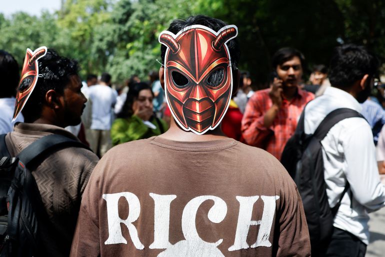 A person wears a cockroach themed mask, as supporters of the Cockroach Janta Party (CJP) await the arrival of Abhijeet Dipke, head of the CJP, on the day of a sit-in protest demanding the resignation of Indian Education Minister Dharmendra Pradhan, in New Delhi, India, June 6, 2026. REUTERS/Adnan Abidi