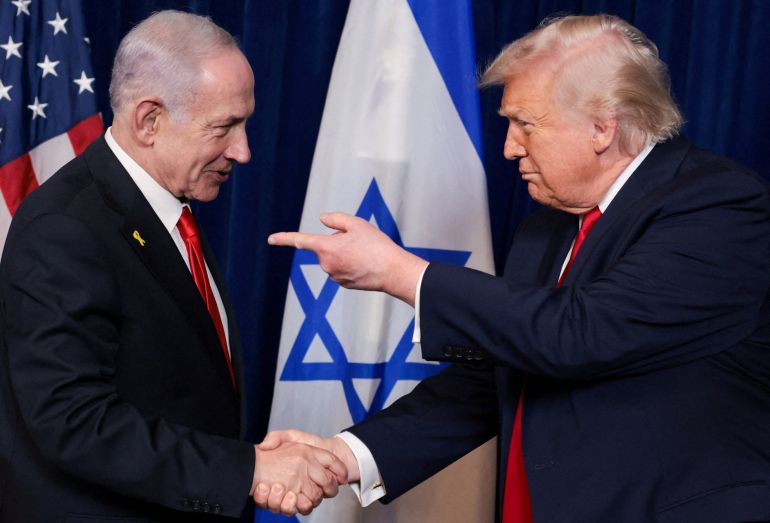 reuters_6a240005-1780744197-1 FILE PHOTO: U.S. President Donald Trump points his finger towards Israeli Prime Minister Benjamin Netanyahu as they shake hands during a press conference after meeting at Trump’s Mar-a-Lago club in Palm Beach, Florida, U.S., December 29, 2025. REUTERS/Jonathan Ernst/File Photo