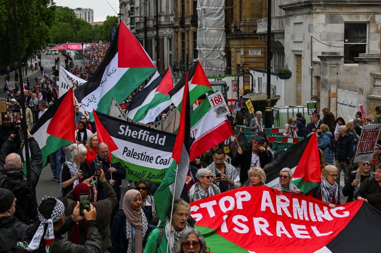 reuters_6a28693c-1781033276 People carry Palestinian flags as demonstrators from the Palestine Solidarity Campaign hold a march to mark the 78th anniversary of the Nakba and against the "Unite the Kingdom" rally taking place in London organised by British anti-immigration activist Stephen Yaxley-Lennon, also known as Tommy Robinson, in London, Britain, May 16, 2026. REUTERS/Chris J Ratcliffe