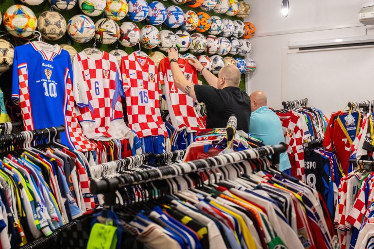 reuters_6a2c4f70-1781288816 Davor Tislar, 42 and Marko Senicnjak, 43, who own more than 6,000 football jerseys, over 300 balls and more than 300 pairs of football boots, show Croatia's national team football jerseys from their collection of jerseys and other memorabilia in Zagreb, Croatia, June 10, 2026. REUTERS/Antonio Bronic