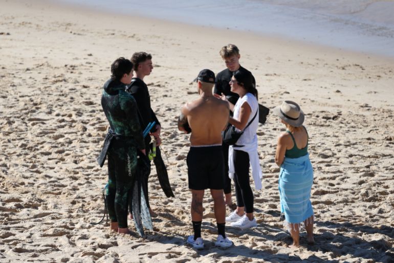 reuters_6a2cf14a-1781330250 People react after reports of a shark attack at Coogee Beach in Sydney, Australia, June 13, 2026. REUTERS/Hollie Adams