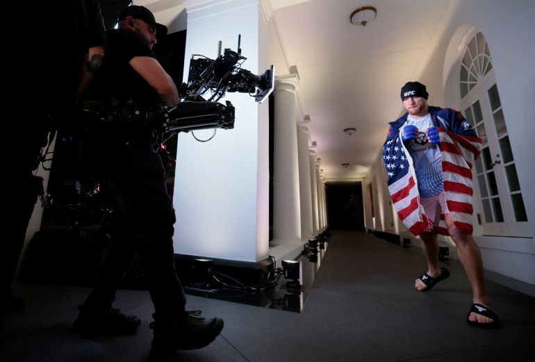 reuters_6a2fa383-1781506947 Justin Gaethje walks to his fight with Ilia Topuria in their lightweight championship bout at UFC Freedom 250 at the White House in Washington, D.C., U.S., June 15, 2026. REUTERS/Jonathan Ernst