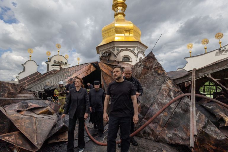 reuters_6a305c59-1781554265 Ukraine's President Volodymyr Zelenskiy and Ukrainian Prime Minister Yulia Svyrydenko visit the Dormition Cathedral of the Kyiv Pechersk Lavra, which was hit during Russian missile and drone strikes, amid Russia's attack on Ukraine, in Kyiv, Ukraine June 15, 2026. Ukrainian Presidential Press Service/Handout via REUTERS ATTENTION EDITORS - THIS IMAGE HAS BEEN SUPPLIED BY A THIRD PARTY. TPX IMAGES OF THE DAY