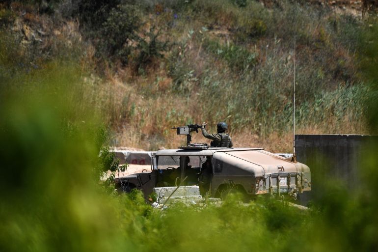 reuters_6a34db18-1781848856 Israeli military vehicles drive on an Israeli road by the Israel-Lebanon border, in northern Israel, June 18, 2026. REUTERS/Gil Eliyahu ISRAEL OUT. NO COMMERCIAL OR EDITORIAL SALES IN ISRAEL