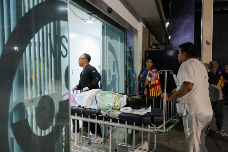 An injured person is taken into the Perez Carreno hospital, after earthquakes hit the country, in Caracas, Venezuela, June 25, 2026. REUTERS/Gaby Oraa