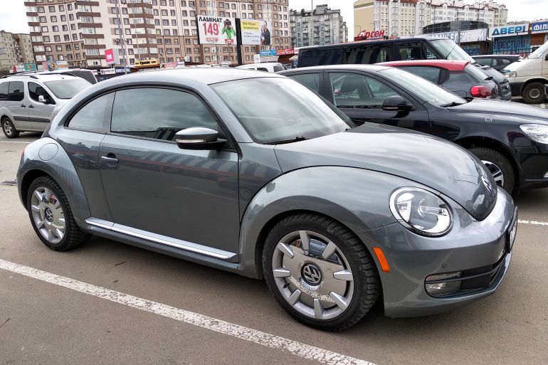 shutterstock_1489828781-1780834147 Kyiv, Ukraine - August 2, 2019: New Volkswagen Beetle car on a parking lot.