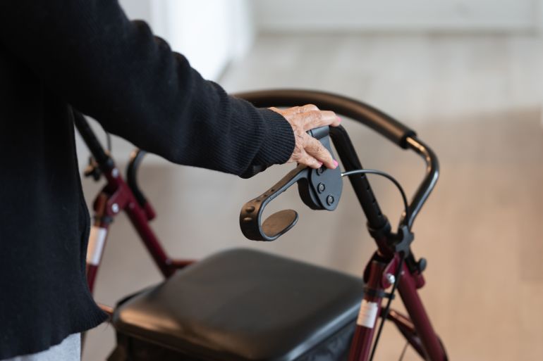 close up of an adult woman hand using a roller