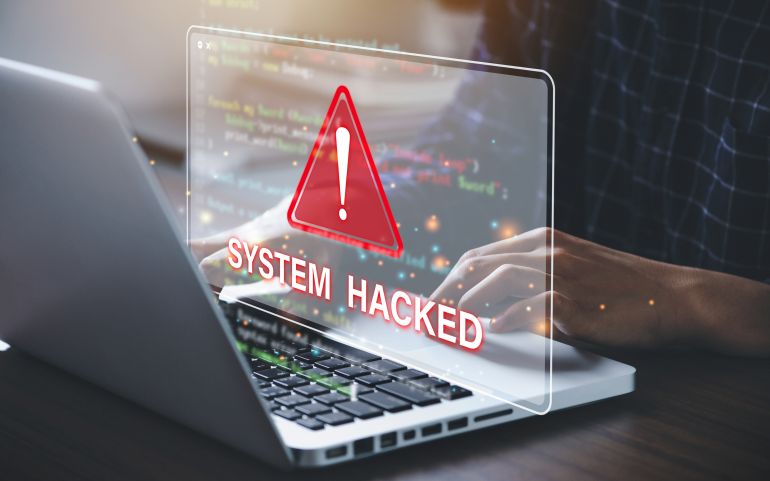 shutterstock_2202066985-1777629503 System hacked alert after cyber attack on computer network. compromised information concept. internet virus cyber security and cybercrime.