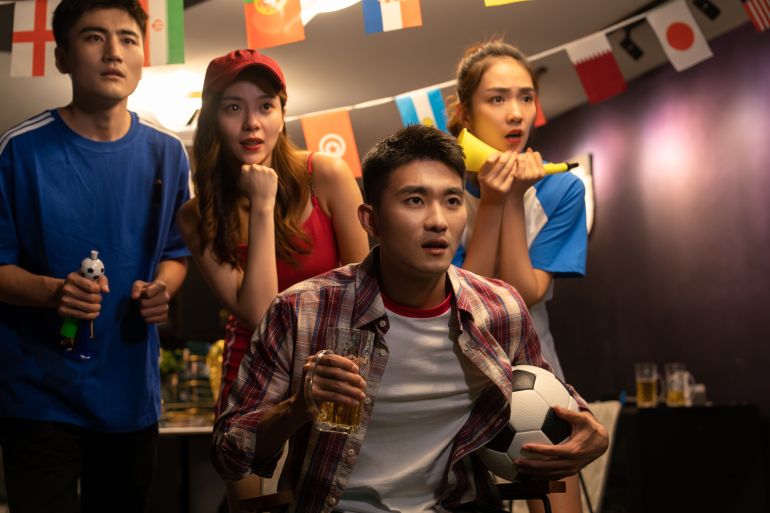 Young friends to watch the football match