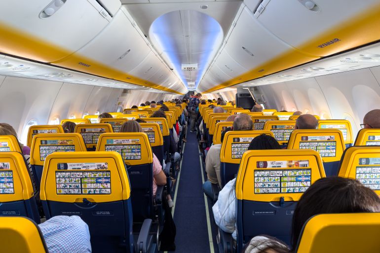 shutterstock_2445379937-1777988064 England - March 09, 2024; Passengers seated inside an airborne Ryanair 8200 plane