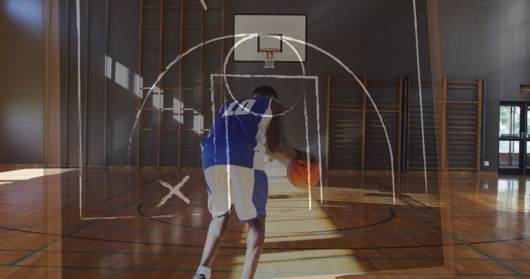 Image of drawing of game plan over african american male basketball player. sports and competition concept digitally generated image.