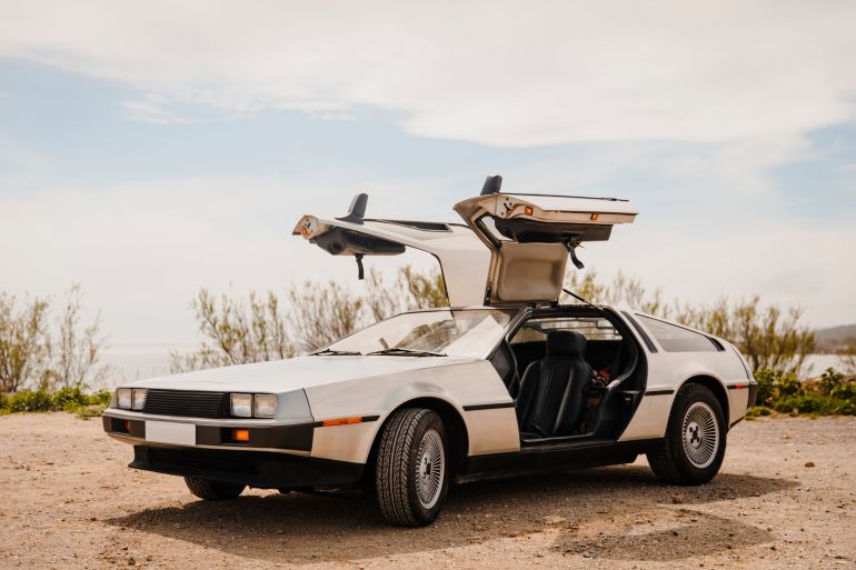 shutterstock_2458970661-1780824051 PORT-LA-NOUVELLE, FRANCE - APRIL 15, 2024: Back to the future car parked with doors up (Delorean)