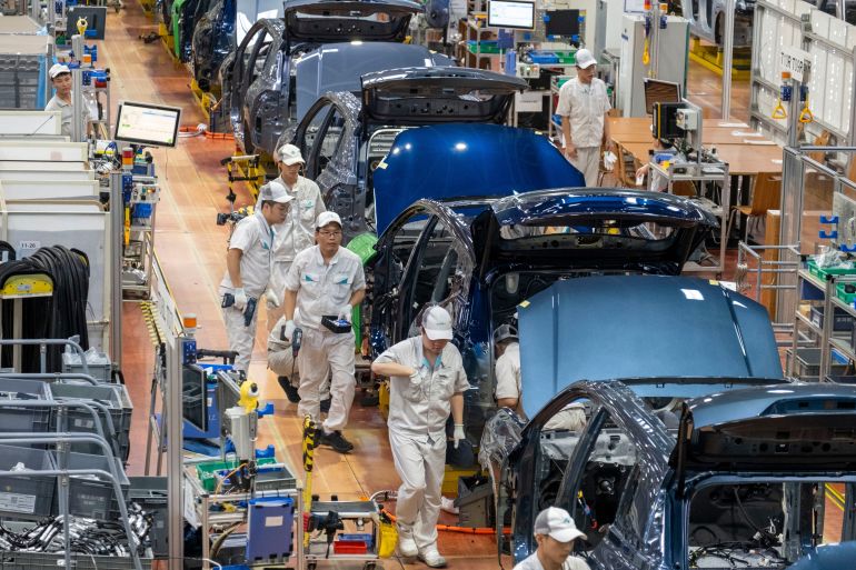 shutterstock_2689724889-1780825990 An electric car production line is seen at the GAC Aion Intelligent Ecological Factory in Guangzhou, Guangdong, China, Friday, September 26, 2025.