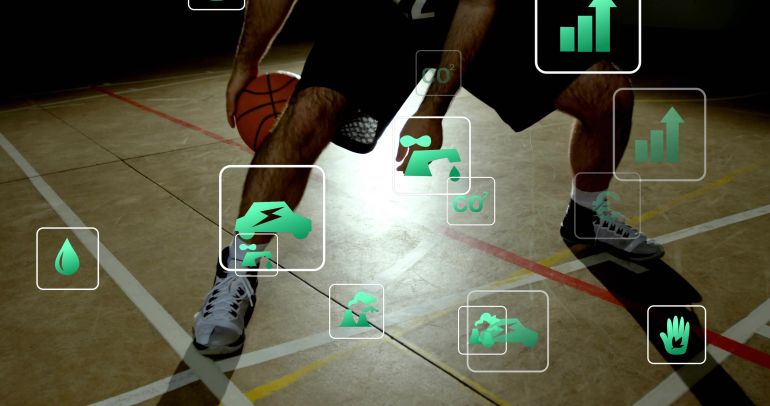 Dribbling player in shorts and sneakers holding low stance on hardwood court with ball AR overlays. Basketball, arena, athletes, competition, analytics, metrics, footwork