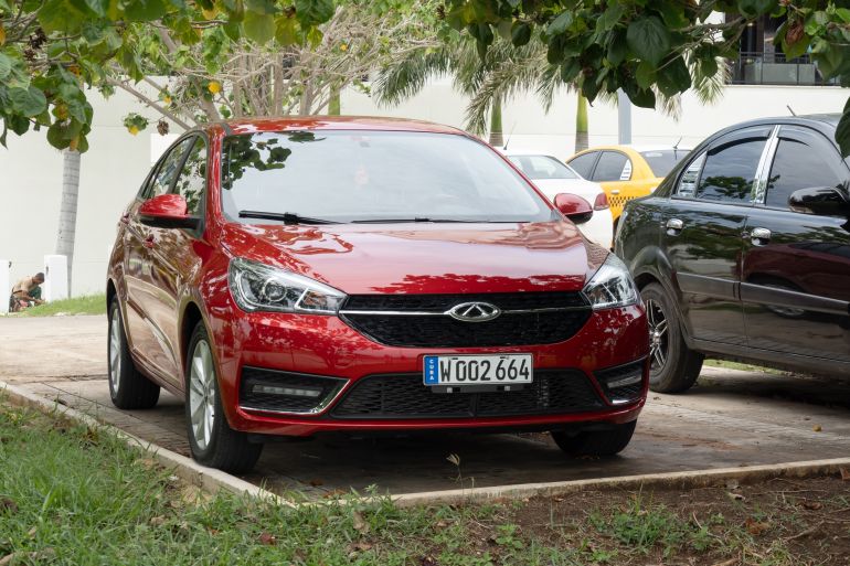 shutterstock_2744594657-1780900214 Varadero, Cuba - September 2, 2023: Red Chery Arrizo 5 Chinese car parked in Cuba