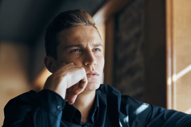 shutterstock_746903104-1780830813-1 business man thinking, portrait, cafe
