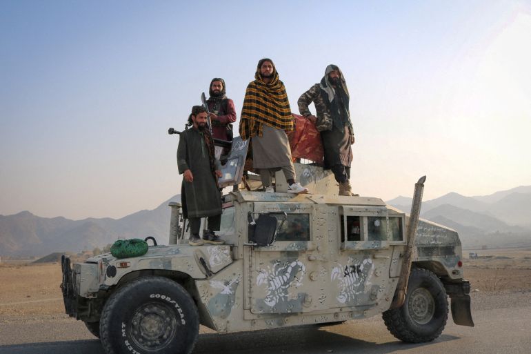 Taliban soldiers pose as they stand on a Humvee, following exchanges of fire between Pakistani and Afghan forces, in Momand Dara, Nangarhar province, Afghanistan, February 28, 2026. REUTERS/Stringer
