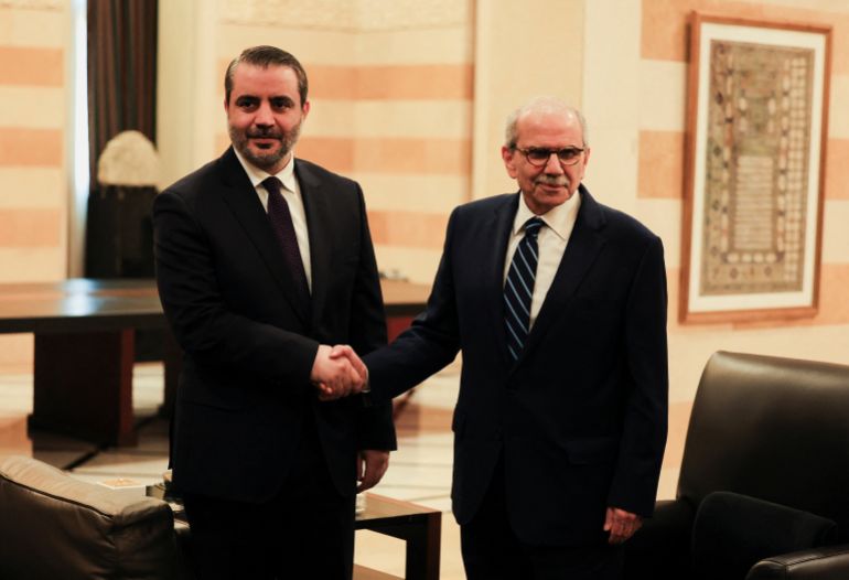 Lebanon's Prime Minister Nawaf Salam shakes hands with Syrian Foreign Minister Asaad Al-Shaibani at the Government Palace, in Beirut, Lebanon, July 2, 2026. REUTERS/Mohamed Azakir