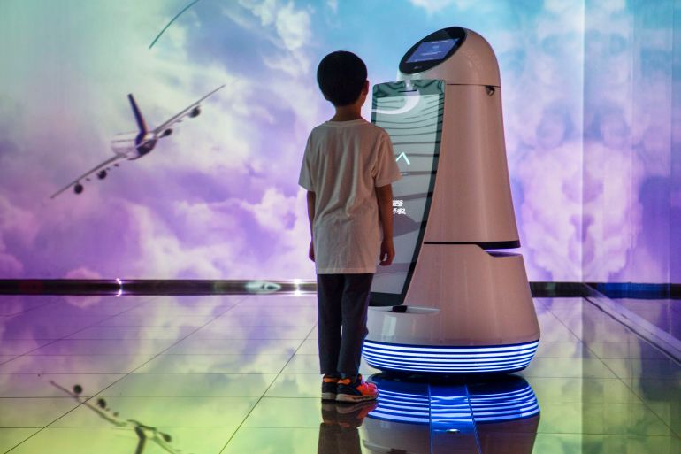 468sh4sysh-1782990735 INCHEON AIRPORT, SEOUL, SOUTH KOREA - 2018/06/12: A young boy communicating with a robot that is on display at Incheon International Airport in Seoul / South Korea. The Guide Robot recognises languages; In addition to English, it can also answer Korean, Chinese and Japanese and recognise boarding cards that are scanned on the touch screen. (Photo by Jonas Gratzer/LightRocket via Getty Images)