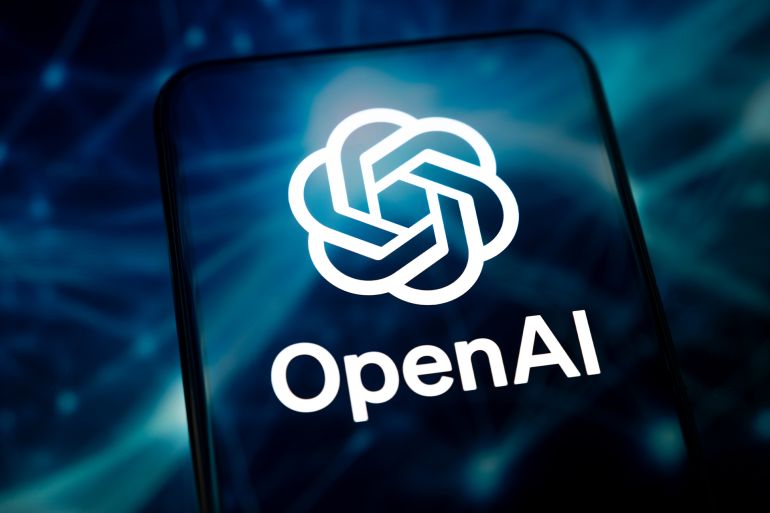 Paris, France - January 16, 2026: The logo of OpenAI, publisher of ChatGPT, appears on a smartphone screen placed on a reflective surface illuminated by an abstract blue illustration.