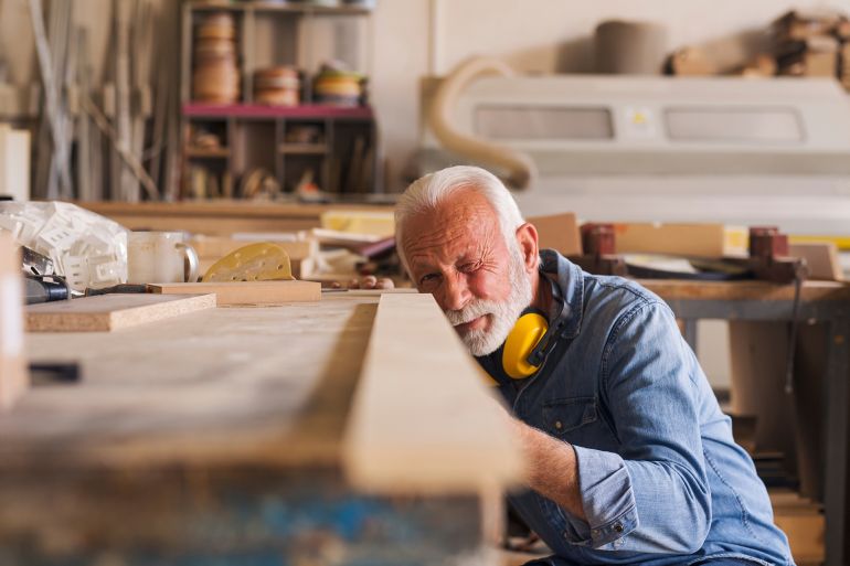 546776y-1783431960 Woodworker at work by Jelena @ادوبي ستوك