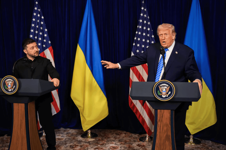 PALM BEACH, FLORIDA - DECEMBER 28: U.S. President Donald Trump speaks alongside Ukrainian President Volodymyr Zelensky during a news conference following their meeting at Trump’s Mar-a-Lago club on December 28, 2025 in Palm Beach, Florida. Trump invited Zelensky to his private club to work on the U.S.-proposed peace plan to end the war in Ukraine as the conflict approaches four years since the sudden full-scale invasion by Russia on February 24, 2022. Joe Raedle/Getty Images/AFP (Photo by JOE RAEDLE / GETTY IMAGES NORTH AMERICA / Getty Images via AFP)