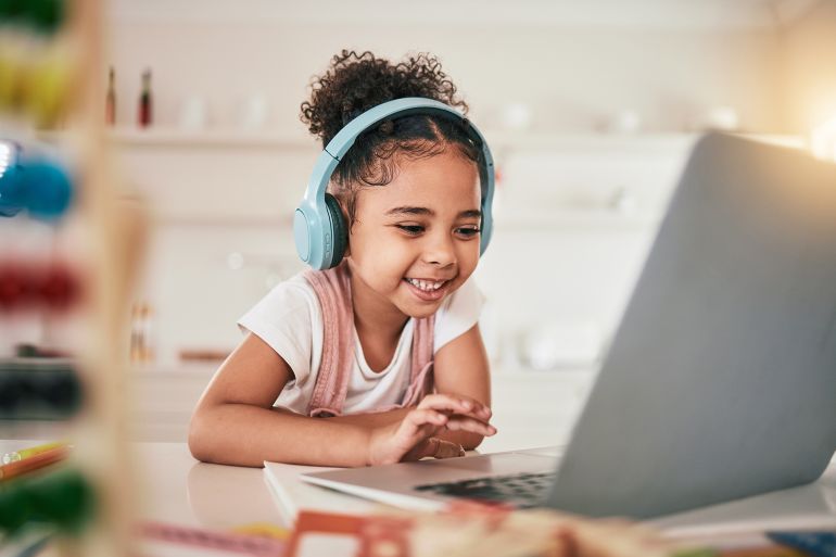 567567-1784359221 aptop, home education and happy child elearning, kindergarten homework or remote school work. Knowledge website, learning software and young kid streaming ... See More by Clayton Daniels/peopleimages.com @ادوبي ستوك