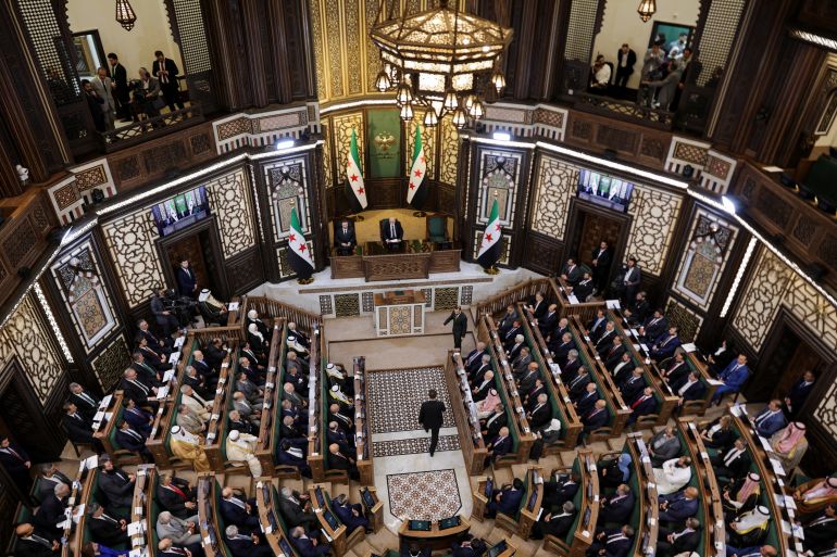 Members of Syria's newly formed People's Assembly attend the body's inaugural session, the first parliament session since the end of the rule of ousted Syrian President Bashar al-Assad, in Damascus, Syria, July 12, 2026. REUTERS/Khalil Ashawi