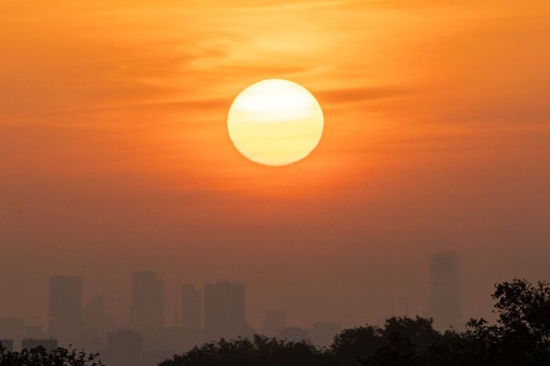 The sun rises over the capital, viewed from Sawyers Hill, Richmond Park in west London on May 24, 2026, as temperatures increase to heatwave levels and are set to rise further over the long bank holiday weekend. (Photo by Brook Mitchell / AFP via Getty Images)