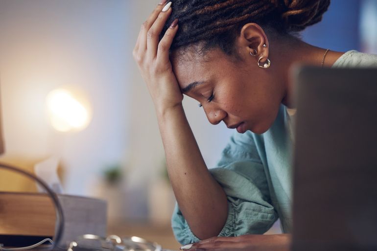 6ryftgh-1759071950 Business woman, depression and stress in an office at night working late on deadline. Tired African entrepreneur person with hands on head for pain, burnout or regret for mistake or fail at work