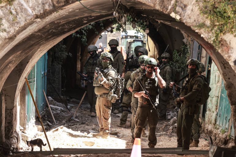 afp_6a3bc26a2ef2-1782301290 Israeli soldiers gather in an alley while patrolling the market in the Old City of Nablus in the northern Israeli-occupied West Bank on June 23, 2026.