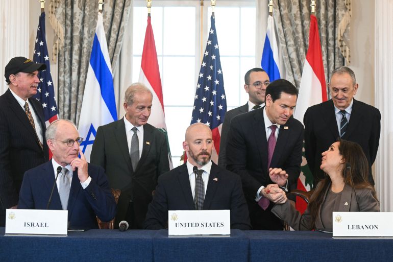 US Secretary of State Marco Rubio shakes hands with Lebanese Ambassador to the US Nada Hamadeh (R, front) as Israeli Ambassador to the US Yechiel Leiter (L, front) and State Department Chief of Staff Daniel Holler (C, front) look on during a signing ceremony at the US Department of State in Washington, DC, on June 26, 2026.