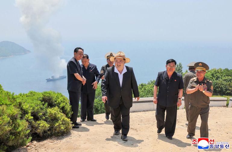This picture taken on July 3, 2026 and released by North Korea's official Korean Central News Agency (KCNA) via KNS on July 5, 2026 shows North Korea's leader Kim Jong Un (C) reacting after observing performance tests of the main weapons systems of the destroyer Kang Kon at an undisclosed location in North Korea. (Photo by KCNA VIA KNS / AFP) / SOUTH KOREA OUT / ---EDITORS NOTE--- RESTRICTED TO EDITORIAL USE - MANDATORY CREDIT "AFP PHOTO/KCNA VIA KNS" - NO MARKETING NO ADVERTISING CAMPAIGNS - DISTRIBUTED AS A SERVICE TO CLIENTS THIS PICTURE WAS MADE AVAILABLE BY A THIRD PARTY. AFP CAN NOT INDEPENDENTLY VERIFY THE AUTHENTICITY, LOCATION, DATE AND CONTENT OF THIS IMAGE.