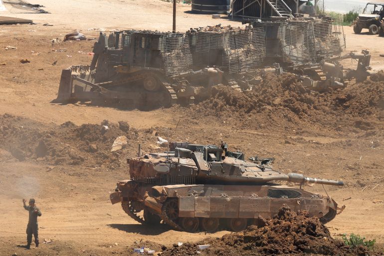 afp_6a49e55e52d9-1783227742 This picture taken from a position in the Upper Galilee in northern Israel shows an Israeli army tank being positioned along the Israel-Lebanon border, on July 1, 2026.