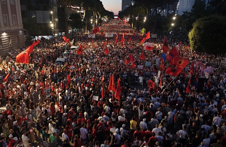 afp_6a49fc3bb02d-1783233595 This aerial photograph shows protesters as they demonstrate in central Tirana against the construction of a luxury resort near a protected natural area on Albania's southern coast, in Tirana, on July 4, 2026.