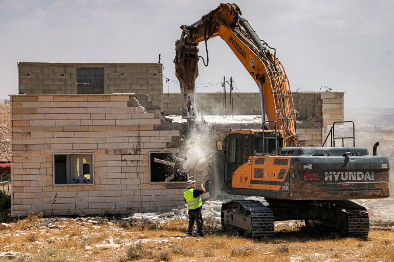 afp_6a4e187b409e-1783502971 An Israeli military excavator demolishes a Palestinian home which Israeli authorities say was built without permission in the village of al-Rifayia, south of Hebron in the occupied West Bank, on July 7, 2026.