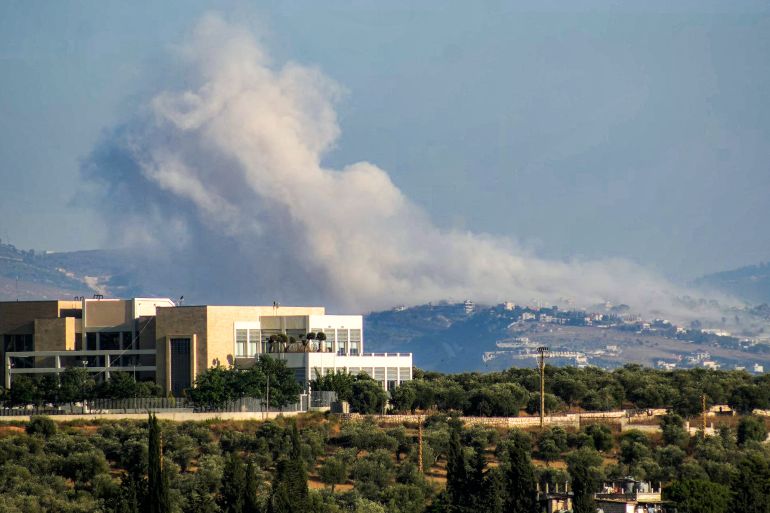 afp_6a4f3b2bdb13-1783577387-1 Smoke rises following Israeli controlled-explosions in the village of al-Taibeh as seen from Nabatieh in southern Lebanon on July 8, 2026.