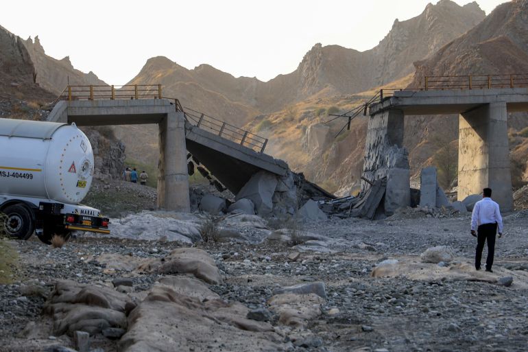 afp_6a5be4fec4d6-1784407294-1 A heavily-damaged bridge which was hit by a US strike is pictured along the road connecting Roudan and Bandar Abbas in southern Iran on July 18, 2026.