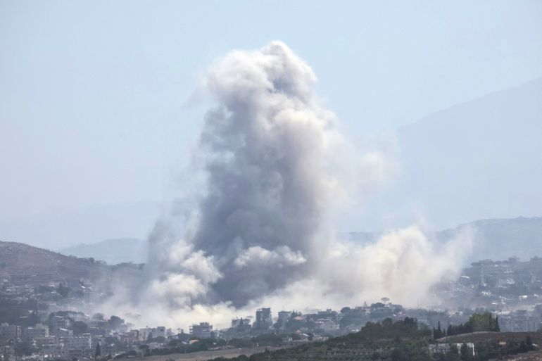 This image taken from the vicinity of the village Zawtar al-Sharqiyah in southern Lebanon, shows smoke rising from the site of an explosion carried out by the Israeli military, in the village of Kfar Tibnit on July 23, 2026.