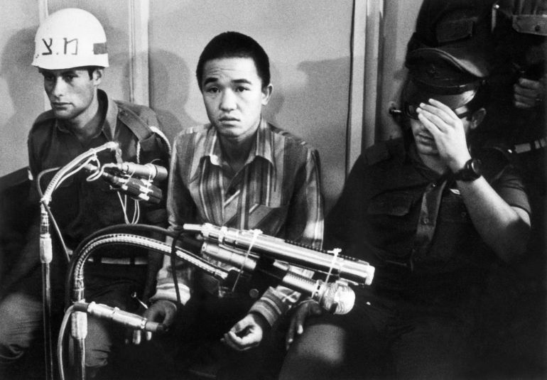 afp_6a627873bae7-1784838259 (FILES) This photo taken on July 10, 1972 shows Kozo Okamoto (C) -- the only surviving member of the three-man "Japanese Red Army" (JRA) commando unit that killed 26 people in an attack on Israel's Lod airport earlier on May 30 -- during the opening of his trial before a military tribunal at an undisclosed location in central Israel.