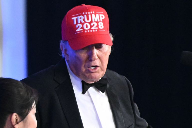 US President Donald Trump wears a "Trump 2028" hat while he speaks during the 2026 White House Correspondents' Association (WHCA) Dinner at the Waldorf Astoria in Washington, DC, on July 24, 2026.