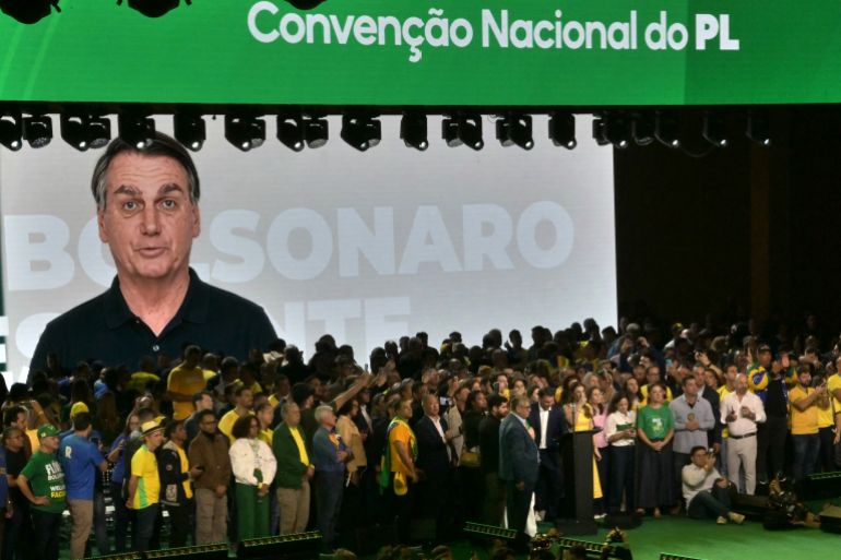 afp_6a655e60d6d4-1785028192 An AI generated video of former president Jair Bolsonaro -who was banned from taking part as he is serving house arrest- is screened during the launching of the presidential candidacy of his son, right-wing presidential hopeful Flavio Bolsonaro within the Liberal Party (PL) convention, in Sao Paulo, Brazil on July 25, 2026.