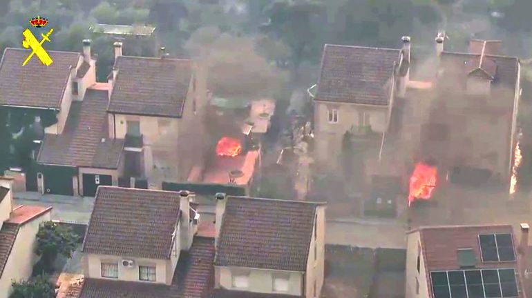 afp_6a678c218162-1785170977 This screen grab of a handout video taken and released on July 25, 2026 by Spain's Guardia Civil shows fires in a residential street of Robledo De Chavela, 60 kms west of Madrid.