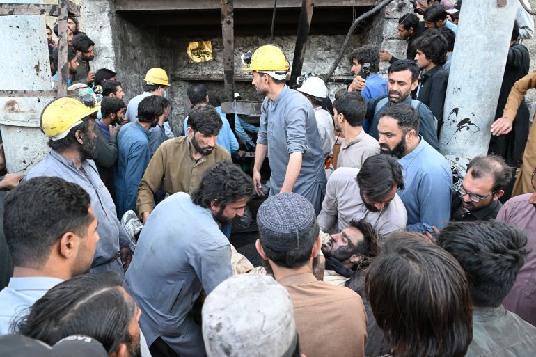 afp_6a6c2c716769-1785474161 EDITORS NOTE: Graphic content / Coal miners and relatives carry the body of a miner after a coal mine collapsed in the Surange area, some 50 kilometres east of Quetta, on July 30, 2026.