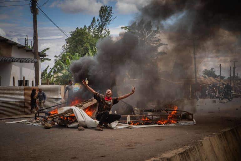ap_69059bf94662c-1761975289 People protest in the streets of Arusha, Tanzania, on election day Wednesday, Oct. 29, 2025. (AP Photo/str)
