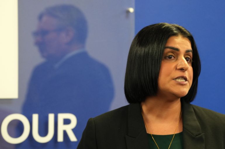 ap_6967d81f5cf99-1768413215 FILE - Britain's Prime Minister Keir Starmer, left, is reflected as Britain's Home Secretary Shabana Mahmood speaks to members of the Jewish community at the Community Security Trust (CST) in north west London, Thursday, Oct. 16, 2025. (Carlos Jasso, Pool Photo via AP, file)