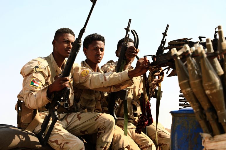 ap_6a47cda1e8131-1783090593 FILE - Sudanese soldiers from the Rapid Support Forces unit patrol during a rally for Gen. Mohammed Hamdan Dagalo, in Garawee town, north of Sudan, on June 15, 2019. (AP Photo, File)