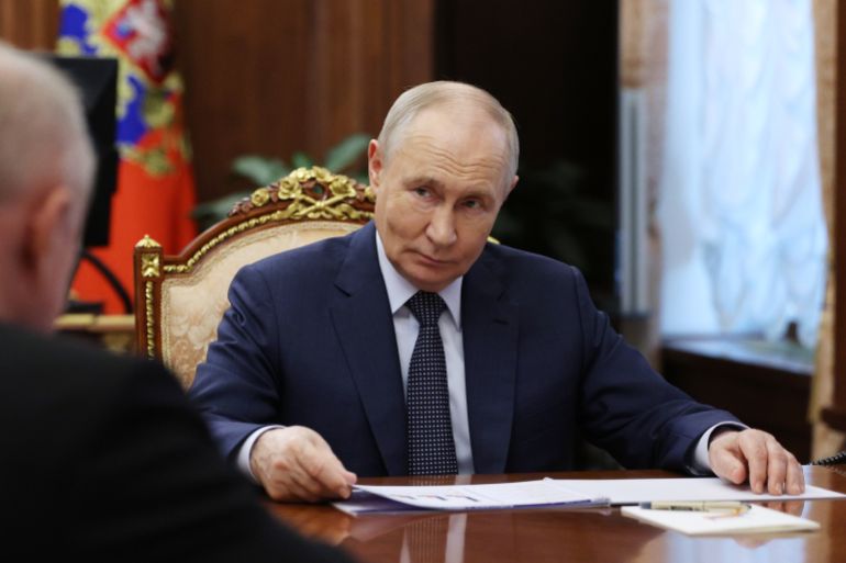 ap_6a559df17b3e7-1783995889 Russian President Vladimir Putin listens to President of the Russian Chamber of Commerce and Industry Sergei Katyrin, back to a camera, at the Kremlin in Moscow, Thursday, July 9, 2026. (Gavriil Grigorov/Sputnik, Kremlin Pool Photo via AP)